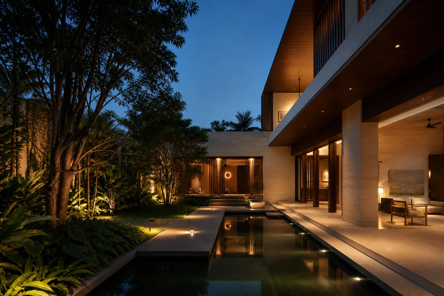 Contemporary Bengaluru residence with a tropical courtyard and reflecting pool at dusk